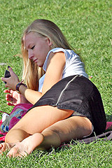 Looking up skirt of gal in park